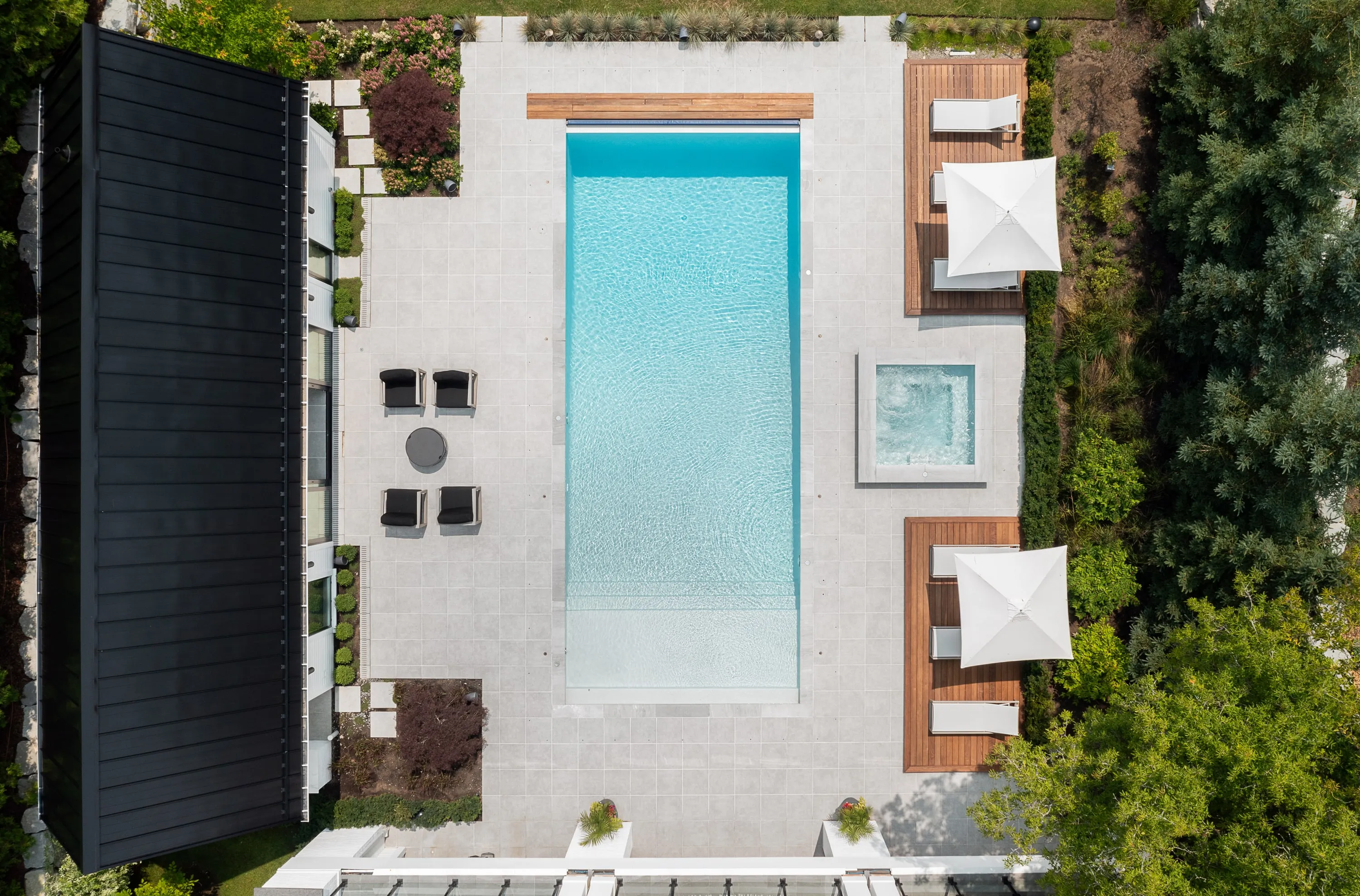 Pool terrace and loungers seen from above.