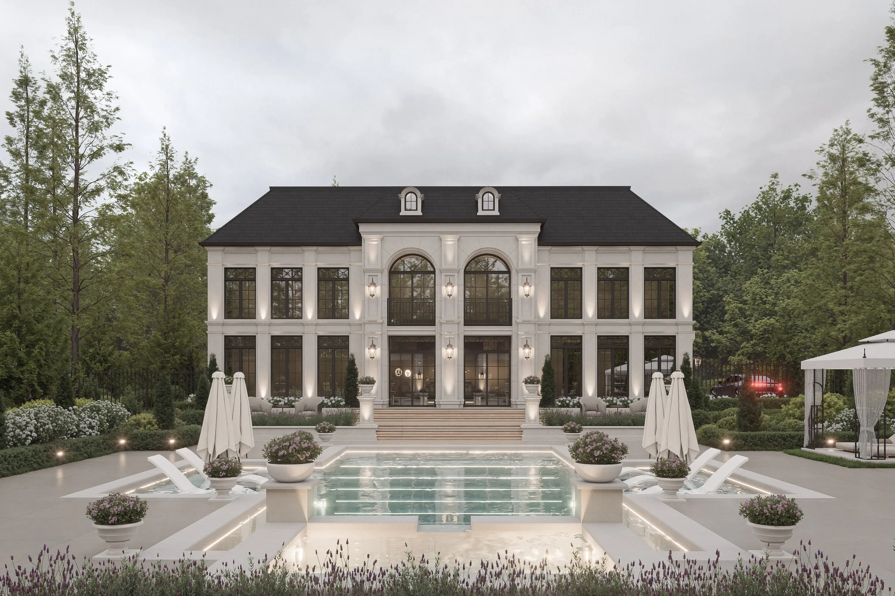 Design rendering of a classical stone residence seen across a lit pool at dusk.