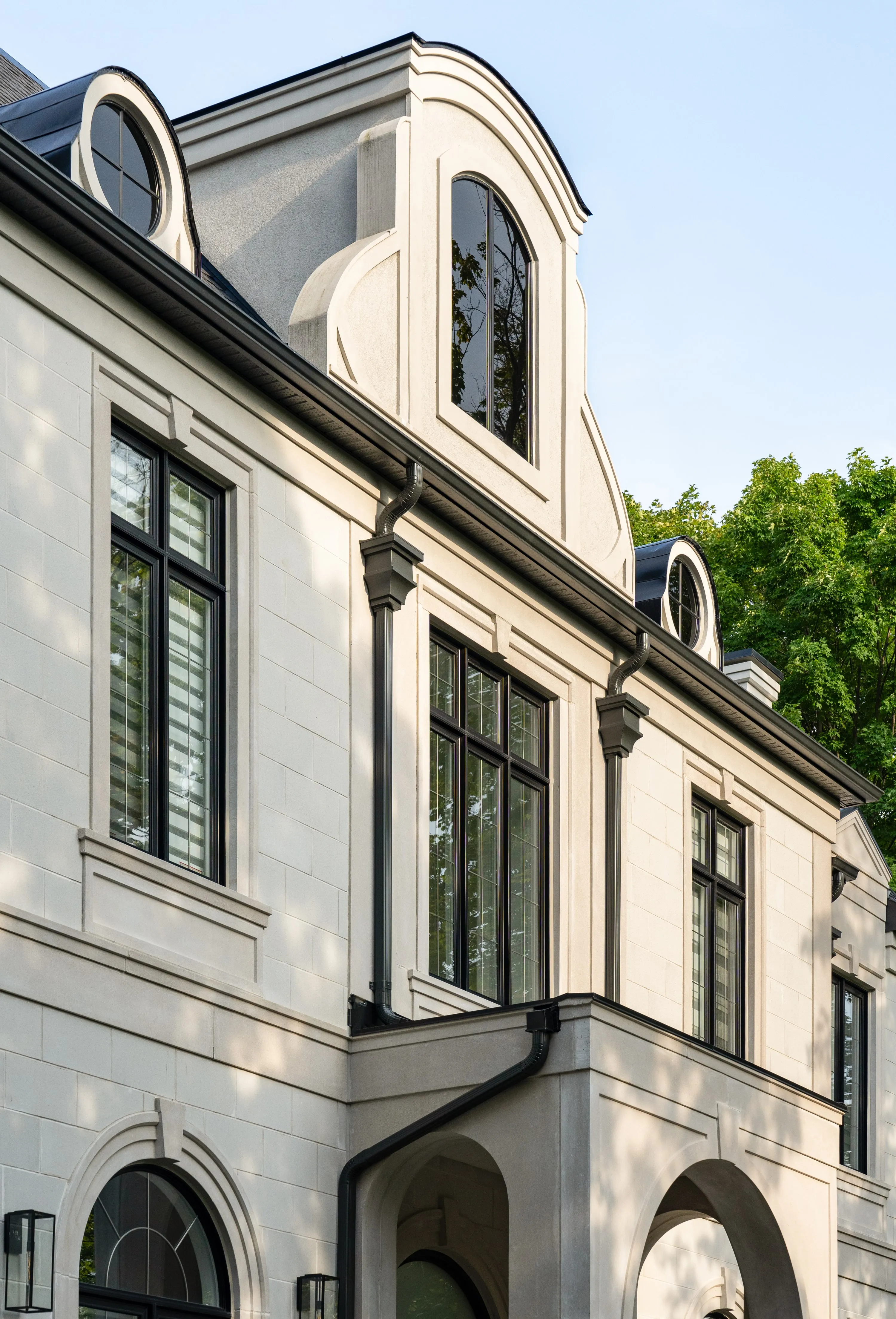 Dormer and mansard detail against the sky.